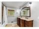 Elegant bathroom with double vanity and a large mirror at 8316 Hewlett Rd, Sandy Springs, GA 30350