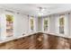 Spacious bedroom with hardwood floors and multiple windows at 8316 Hewlett Rd, Sandy Springs, GA 30350