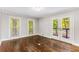 Bright bedroom featuring hardwood floors and French doors at 8316 Hewlett Rd, Sandy Springs, GA 30350