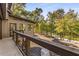 Deck overlooking a lake with wooded landscape and private backyard at 8316 Hewlett Rd, Sandy Springs, GA 30350