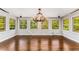 Bright dining room with hardwood floors and a stunning chandelier at 8316 Hewlett Rd, Sandy Springs, GA 30350