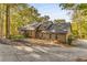 Lakefront home with expansive deck and stone accents at 8316 Hewlett Rd, Sandy Springs, GA 30350