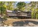Lakefront home with large deck and stone accents at 8316 Hewlett Rd, Sandy Springs, GA 30350
