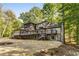 Lakefront home with expansive deck and stone accents at 8316 Hewlett Rd, Sandy Springs, GA 30350