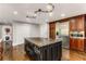 Gourmet kitchen featuring granite countertops, stainless steel appliances, and dark wood cabinetry at 8316 Hewlett Rd, Sandy Springs, GA 30350
