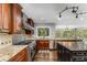 Modern kitchen with granite countertops, stainless steel appliances, and a large island at 8316 Hewlett Rd, Sandy Springs, GA 30350