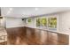 Spacious living room with hardwood floors and sliding glass doors to deck at 8316 Hewlett Rd, Sandy Springs, GA 30350