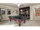 Basement recreation area with ping pong table and wet bar at 443 Wimbledon Ne Rd, Atlanta, GA 30324