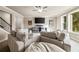 Large basement Gathering room with sectional sofa and TV at 443 Wimbledon Ne Rd, Atlanta, GA 30324