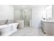 Spa-like bathroom featuring a soaking tub and a large walk-in shower at 443 Wimbledon Ne Rd, Atlanta, GA 30324