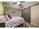 Basement bedroom with a barn door and floral bedding at 443 Wimbledon Ne Rd, Atlanta, GA 30324