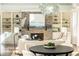Bright dining area with a round table and chairs, overlooking a fireplace at 443 Wimbledon Ne Rd, Atlanta, GA 30324
