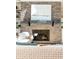Close-up view of a brick fireplace with a rustic mantel at 443 Wimbledon Ne Rd, Atlanta, GA 30324