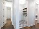 Convenient laundry room with wood shelves and herringbone tile floor at 443 Wimbledon Ne Rd, Atlanta, GA 30324