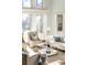 Sunlit living room with comfortable seating and large windows at 443 Wimbledon Ne Rd, Atlanta, GA 30324