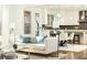 Open living room with kitchen view and natural light at 443 Wimbledon Ne Rd, Atlanta, GA 30324