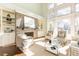 Sunlit living room boasts a brick fireplace, built-ins, and abundant natural light at 443 Wimbledon Ne Rd, Atlanta, GA 30324