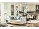 Open living room with kitchen view and natural light at 443 Wimbledon Ne Rd, Atlanta, GA 30324