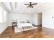 Bright main bedroom features hardwood floors and a ceiling fan at 443 Wimbledon Ne Rd, Atlanta, GA 30324