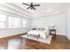 Spacious main bedroom with hardwood floors, a ceiling fan, and large windows at 443 Wimbledon Ne Rd, Atlanta, GA 30324