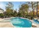 Relaxing kidney-shaped pool with ample lounge space at 443 Wimbledon Ne Rd, Atlanta, GA 30324