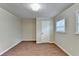 Bright bedroom with wood flooring and neutral walls at 5164 Phillips Dr, Forest Park, GA 30297