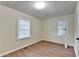 Bright bedroom with hardwood floors and neutral walls at 5164 Phillips Dr, Forest Park, GA 30297