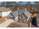 Scenic aerial view showcasing the roof, driveway, and landscaped front yard of this beautiful home at 374 Cherington Ln, Lawrenceville, GA 30044