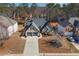 Bird's eye view of the brick home, showcasing its landscaped yard and two-car garage at 374 Cherington Ln, Lawrenceville, GA 30044