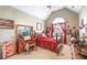 Charming bedroom with vaulted ceiling, arched window with red curtains, and carpet flooring at 374 Cherington Ln, Lawrenceville, GA 30044