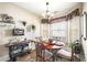 Cozy breakfast nook featuring a charming chandelier and natural lighting from nearby windows at 374 Cherington Ln, Lawrenceville, GA 30044