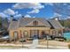 Community clubhouse exterior featuring a stone entrance, well-maintained landscaping, and accessible parking at 374 Cherington Ln, Lawrenceville, GA 30044