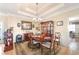 Elegant dining room with coffered ceilings, chandelier, and traditional furnishings, perfect for hosting gatherings at 374 Cherington Ln, Lawrenceville, GA 30044