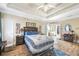 Inviting main bedroom with trey ceiling, wood floors, and connecting access to the primary bath at 374 Cherington Ln, Lawrenceville, GA 30044