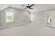 Bright bonus room with a ceiling fan, windows, and access to a balcony at 3909 Enclave Way, Tucker, GA 30084