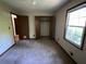 Spacious bedroom with a large closet and neutral carpeting at 2832 Jordan Forest Nw Trl, Lawrenceville, GA 30044