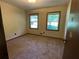 Well-lit bedroom featuring carpet floors and two large windows at 2832 Jordan Forest Nw Trl, Lawrenceville, GA 30044