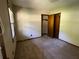 Simple bedroom with carpet and double door closet at 2832 Jordan Forest Nw Trl, Lawrenceville, GA 30044