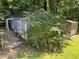 Two storage sheds in backyard, one gray, one wooden at 2832 Jordan Forest Nw Trl, Lawrenceville, GA 30044