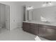 Modern bathroom with double vanity and marble-look floors at 2023 Fern Mountain Ln, Marietta, GA 30064