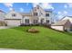 Two story home with white siding, stone accents, and a grassy lawn at 2023 Fern Mountain Ln, Marietta, GA 30064