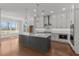 Modern kitchen with white cabinets, large island, and stainless steel appliances at 2023 Fern Mountain Ln, Marietta, GA 30064