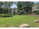 Landscaped green space with building view and dog waste station at 3135 Seven Pines Ct # 101, Atlanta, GA 30339