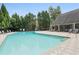 Community swimming pool with lounge chairs and patio at 3135 Seven Pines Ct # 101, Atlanta, GA 30339