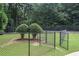 Tennis court with chain-link fence and access gate at 3135 Seven Pines Ct # 101, Atlanta, GA 30339