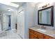 Bathroom with granite countertop, wood cabinets, and tiled floor at 4083 Brookside Manor Dr, Tucker, GA 30084