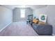 Bright bedroom with gray walls, carpeted floor, and window at 4083 Brookside Manor Dr, Tucker, GA 30084