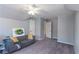 Large bedroom with gray walls, carpeted floor, and ceiling fan at 4083 Brookside Manor Dr, Tucker, GA 30084