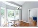 Bright breakfast nook with a white table and chairs, overlooking the backyard at 4083 Brookside Manor Dr, Tucker, GA 30084