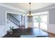 Dining room with hardwood floors, chandelier, and wainscoting at 4083 Brookside Manor Dr, Tucker, GA 30084